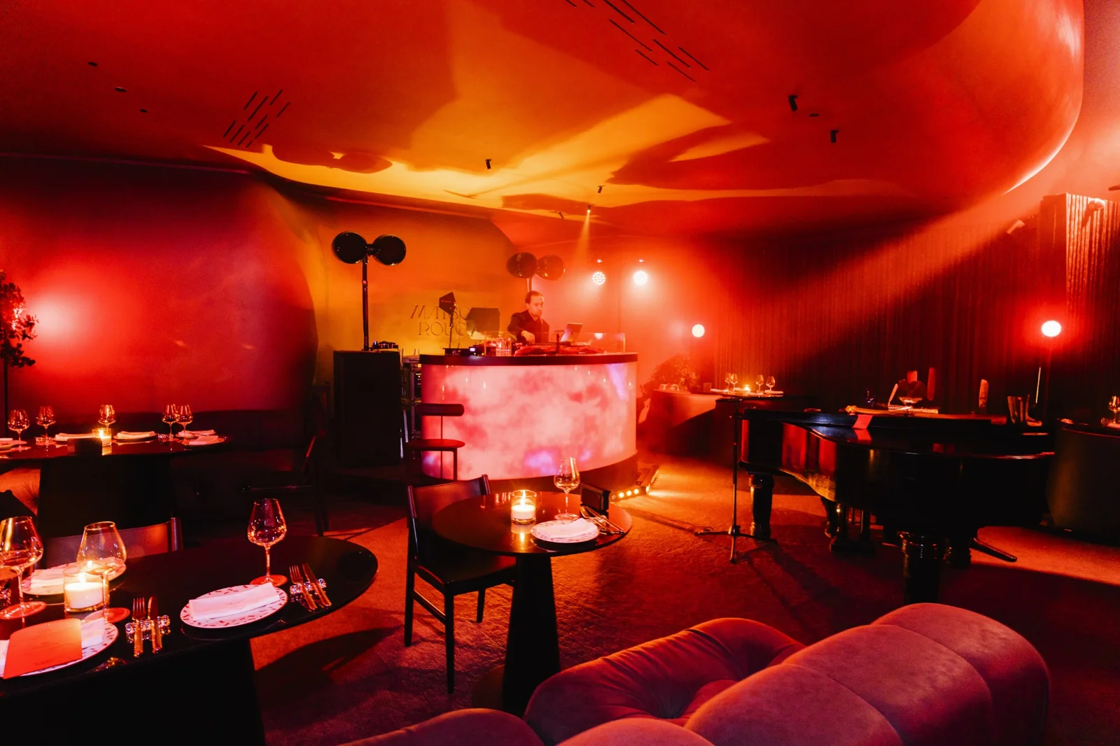 Maison Rouge dining room with tables and a music area