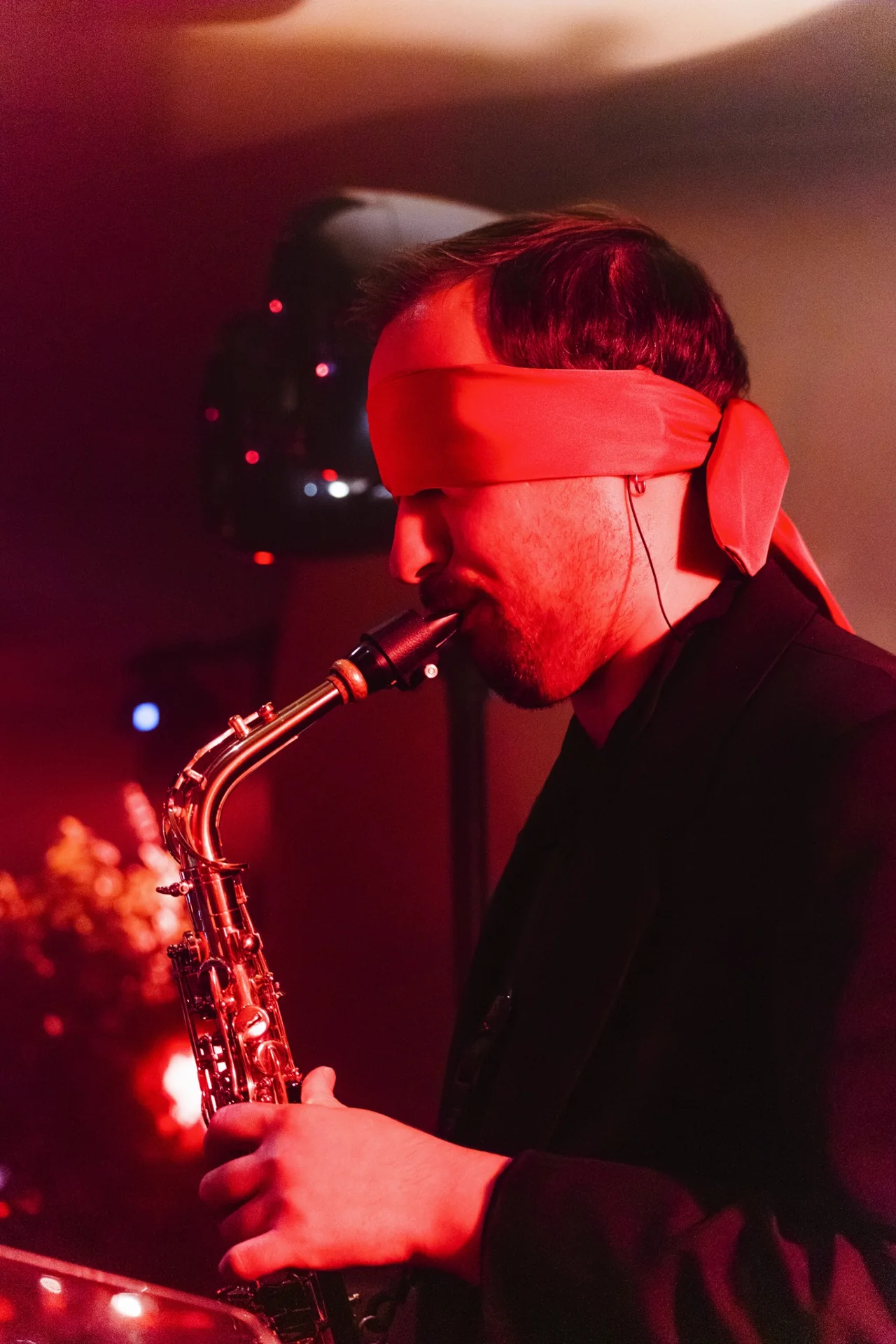 A blindfolded saxophonist